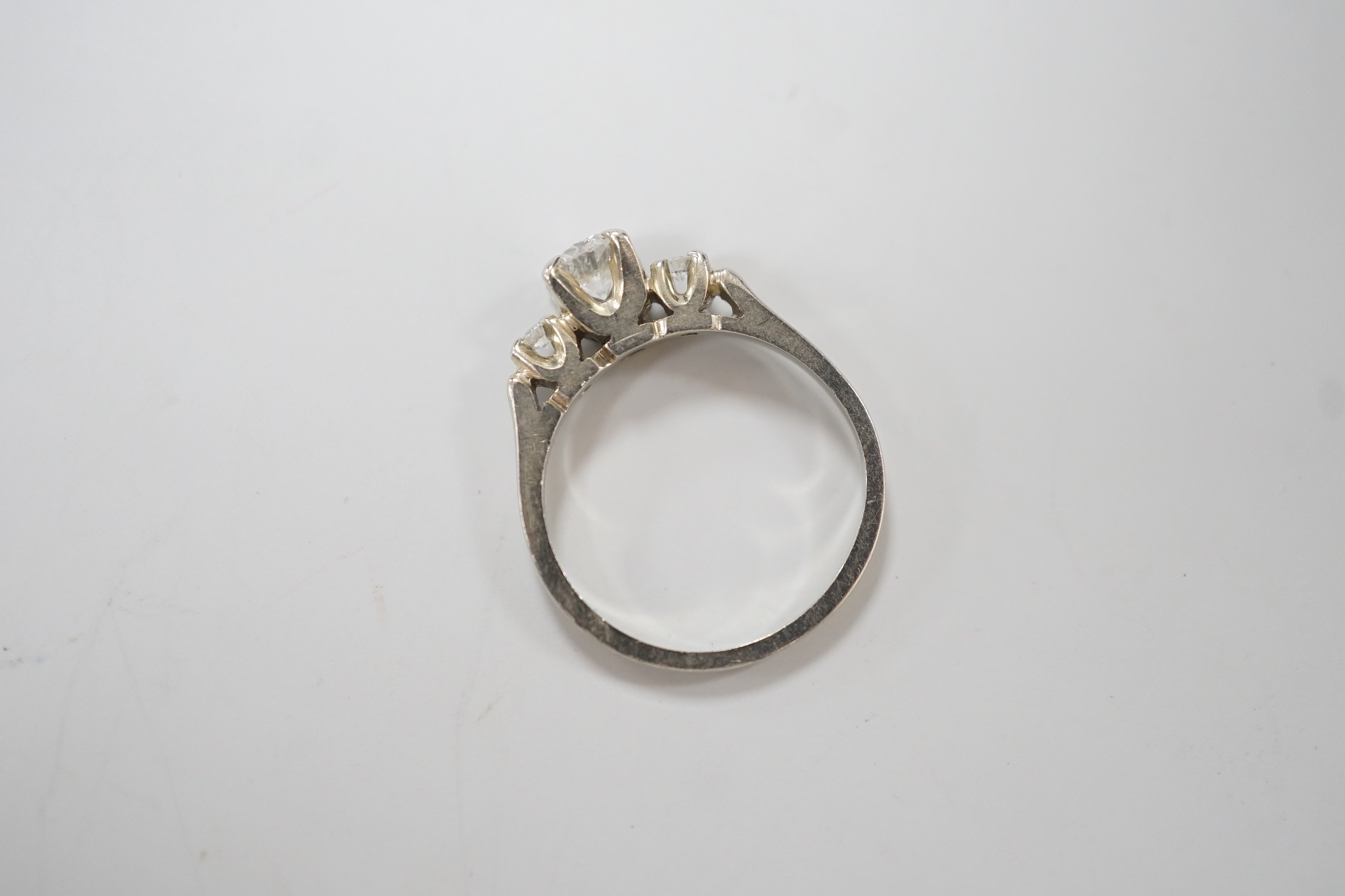 A Canadian Birks 18k white metal and single stone diamond ring, with diamond set shoulders, size H, gross weight 2.7 grams